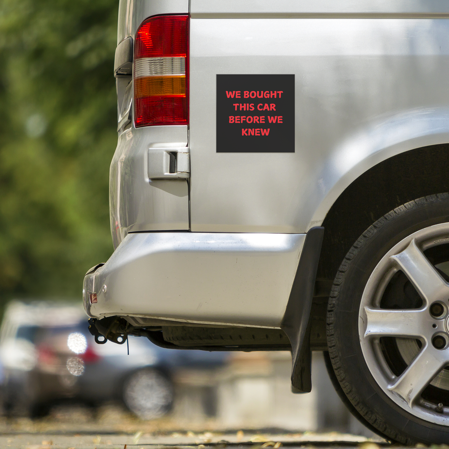 Car magnet featuring a bold, playful message in bright red, all-caps text that reads: "WE BOUGHT THIS CAR BEFORE WE KNEW. Easy to apply and remove, it’s the perfect addition to any vehicle—whether you're driving a compact car or dreaming of that spacious family SUV!
