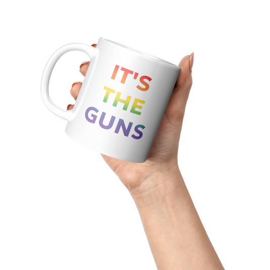 Its_The_Guns_Coffee_Mug_Supporting_Gun__Lifestyle_Raised_Hand_LH_Mockup.png