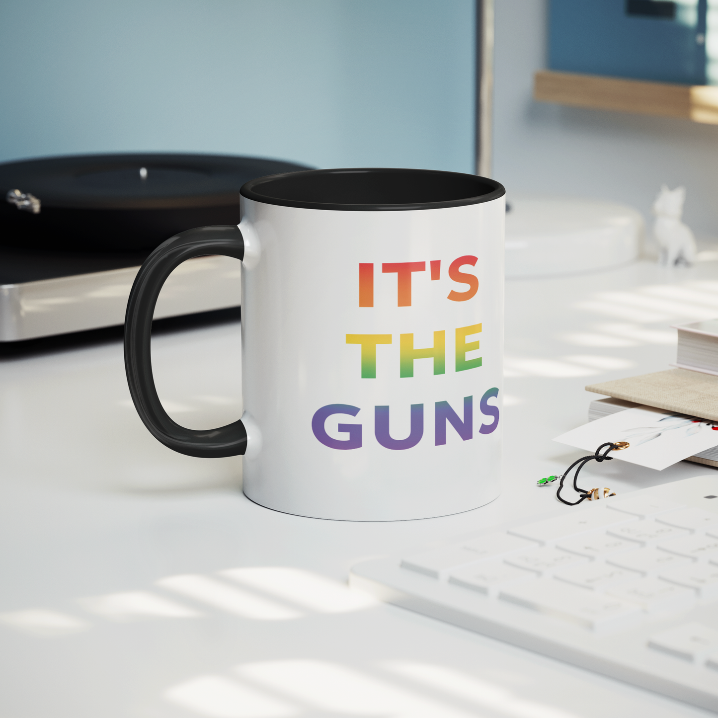 Its_The_Guns_Coffee_Mug_Supporting_Gun__Mug_Lifestyle_Record_Player_Mockup.png