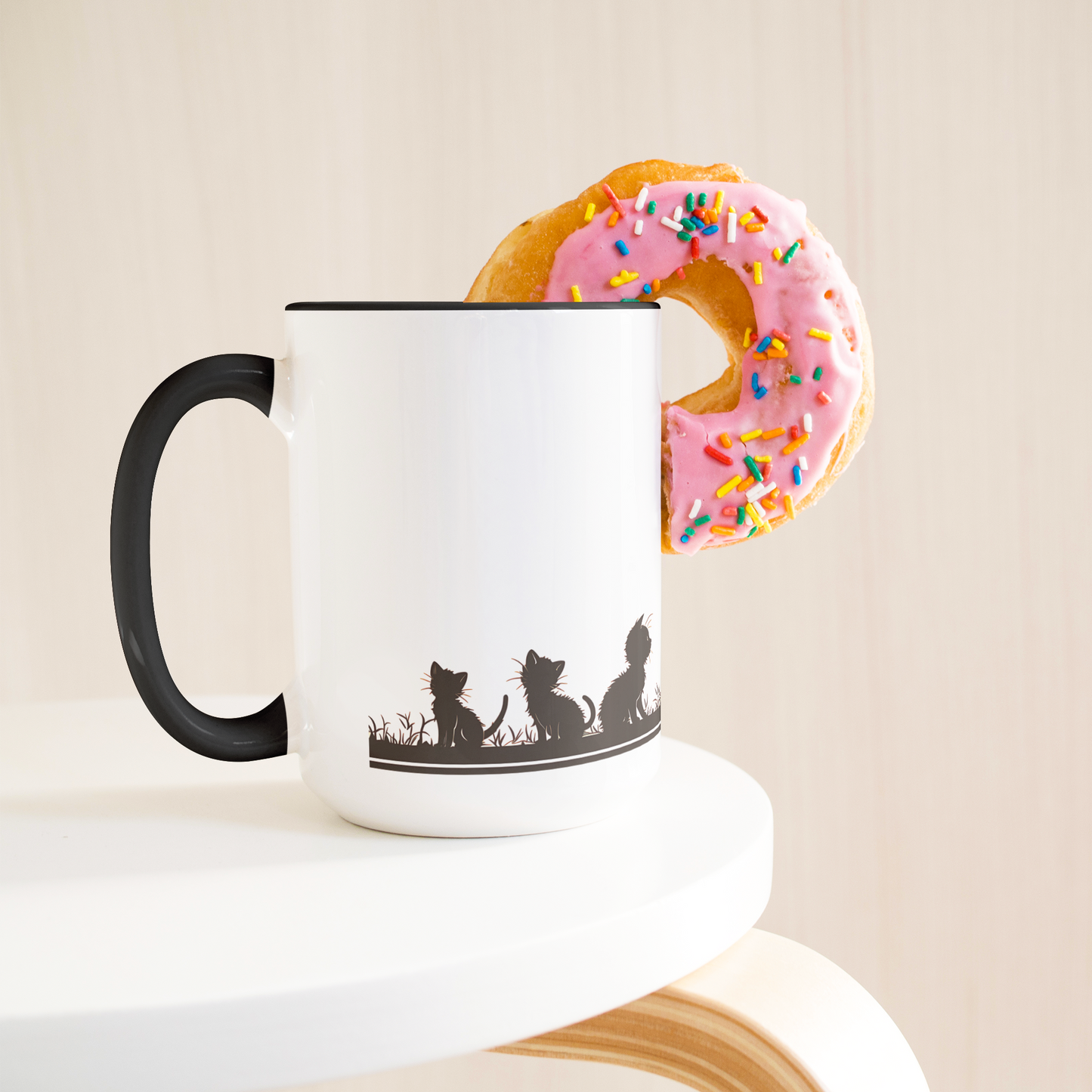 Stylish white ceramic mug with black handle and interior, featuring a wraparound black silhouette design of a papa cat sitting serenely with four playful kittens in a grassy meadow. A butterfly hovers gently above, adding a whimsical charm to the heartwarming scene. The artwork spans the full circumference of the mug, making it visually engaging from all angles. Perfect gift for cat dads, feline lovers, and anyone who appreciates cozy, artistic, pet-themed drinkware. Durable and dishwasher-safe.