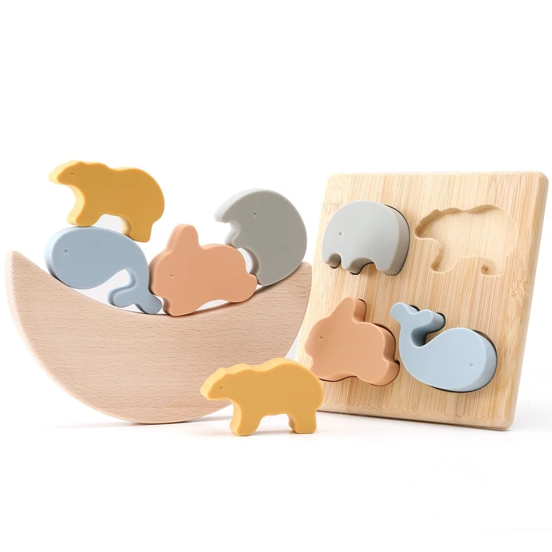 this image shows the silicone animal pieces and the wooden flat puzzle board as well as the stacking crescent