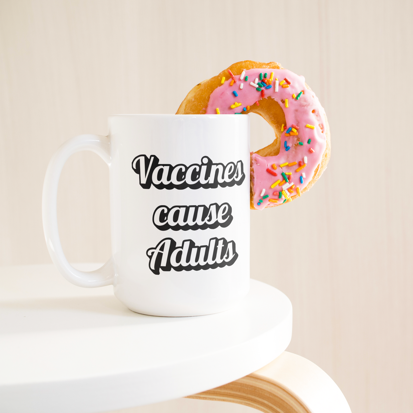 Science_Coffee_Mug__Vaccines_Cause_15ozWhiteMugLifetsyleDonutLH_Mockup.png
