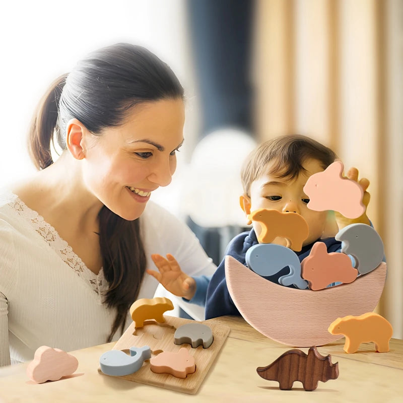 this image shows a mother and child playing with the silicone animal stacker and balancing the items