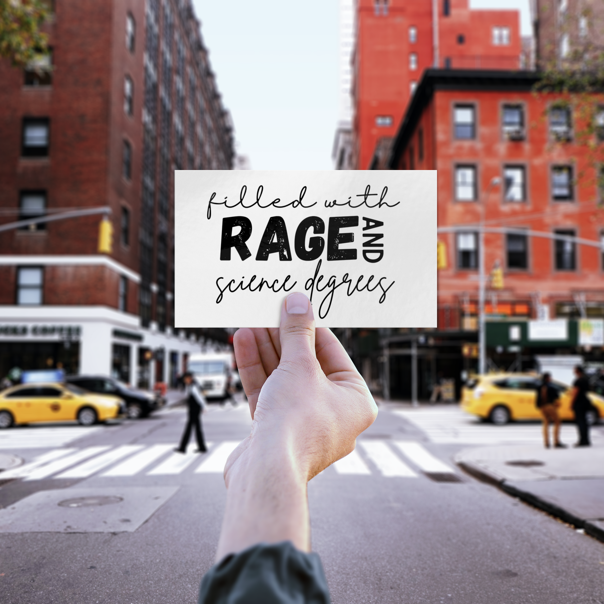 Sticker design featuring a bold, empowering quote: “Filled with RAGE and science degrees.” The word “RAGE” is in all caps, distressed block letters for a dramatic, rebellious feel, while the rest of the phrase is in an elegant, handwritten script that contrasts with the boldness. Perfect for laptops, water bottles, or notebooks—ideal for scientists, students, feminists, and activists who embrace both intellect and passion. Matte finish, durable vinyl.