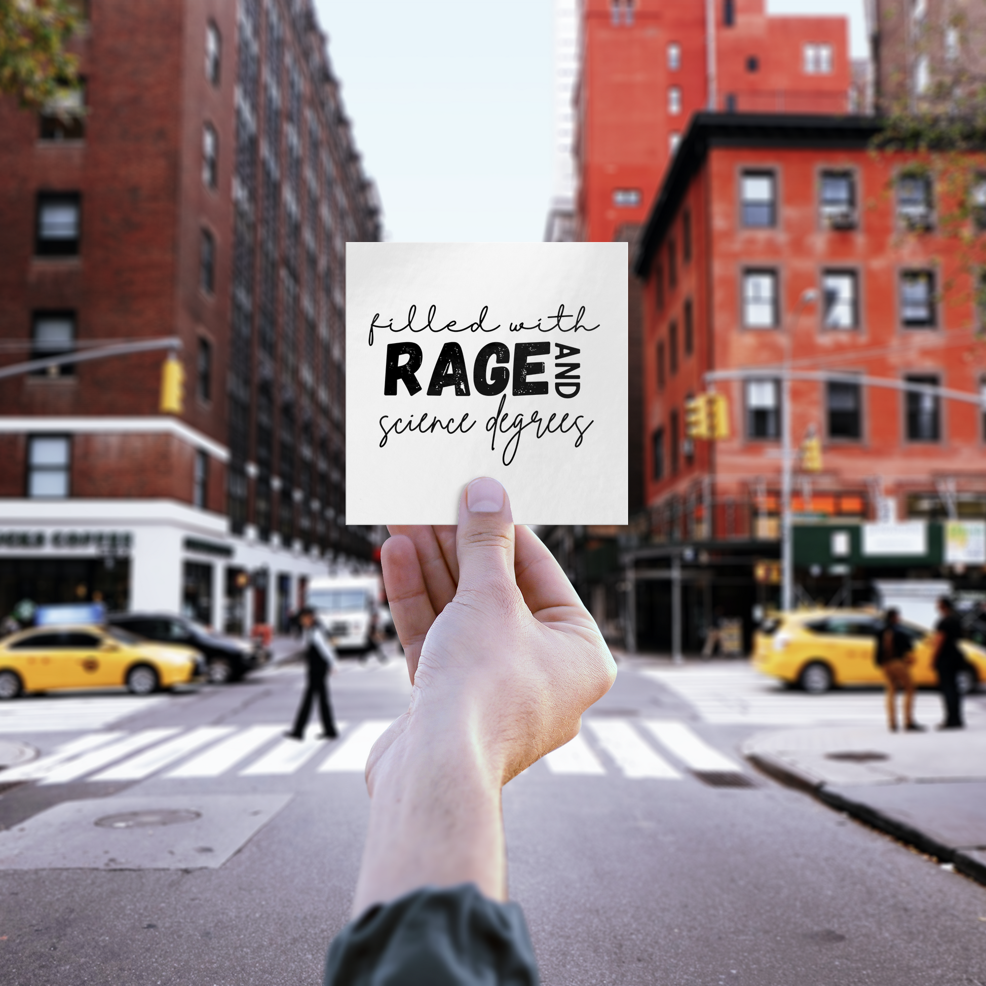 Sticker design featuring a bold, empowering quote: “Filled with RAGE and science degrees.” The word “RAGE” is in all caps, distressed block letters for a dramatic, rebellious feel, while the rest of the phrase is in an elegant, handwritten script that contrasts with the boldness. Perfect for laptops, water bottles, or notebooks—ideal for scientists, students, feminists, and activists who embrace both intellect and passion. Matte finish, durable vinyl.