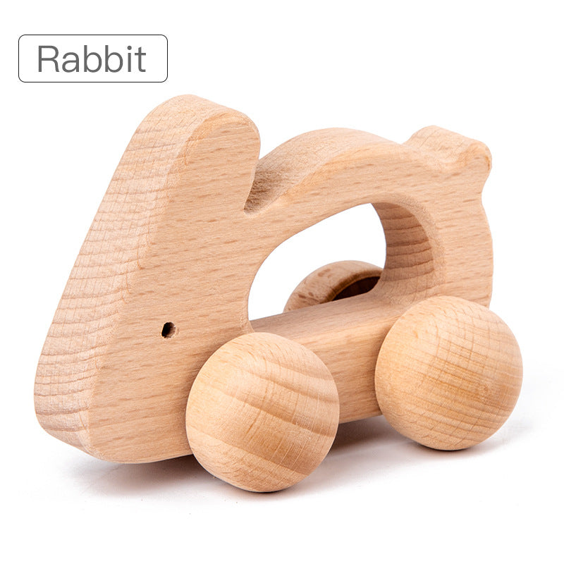 rabbit rolling animal toy with natural wood and large round wheels. opening in center of toy for gripping