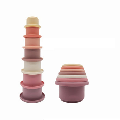 pink silicone cup set stacked on white background