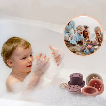 babies playing in a bubble bath with cups and inset photo of family on the beach playing with them