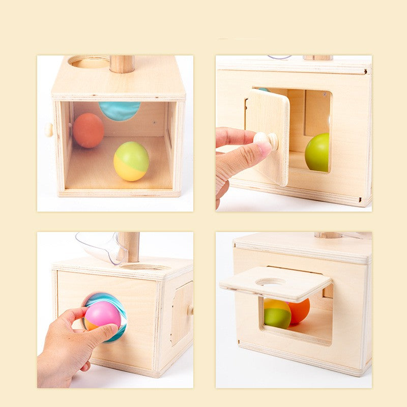 4 images showing the toy in action. one with two balls visualized through the open back of the box. One opening the door on one side and another with a top opening door lifted up and another with a hand removing the ball from a fabric covered opening