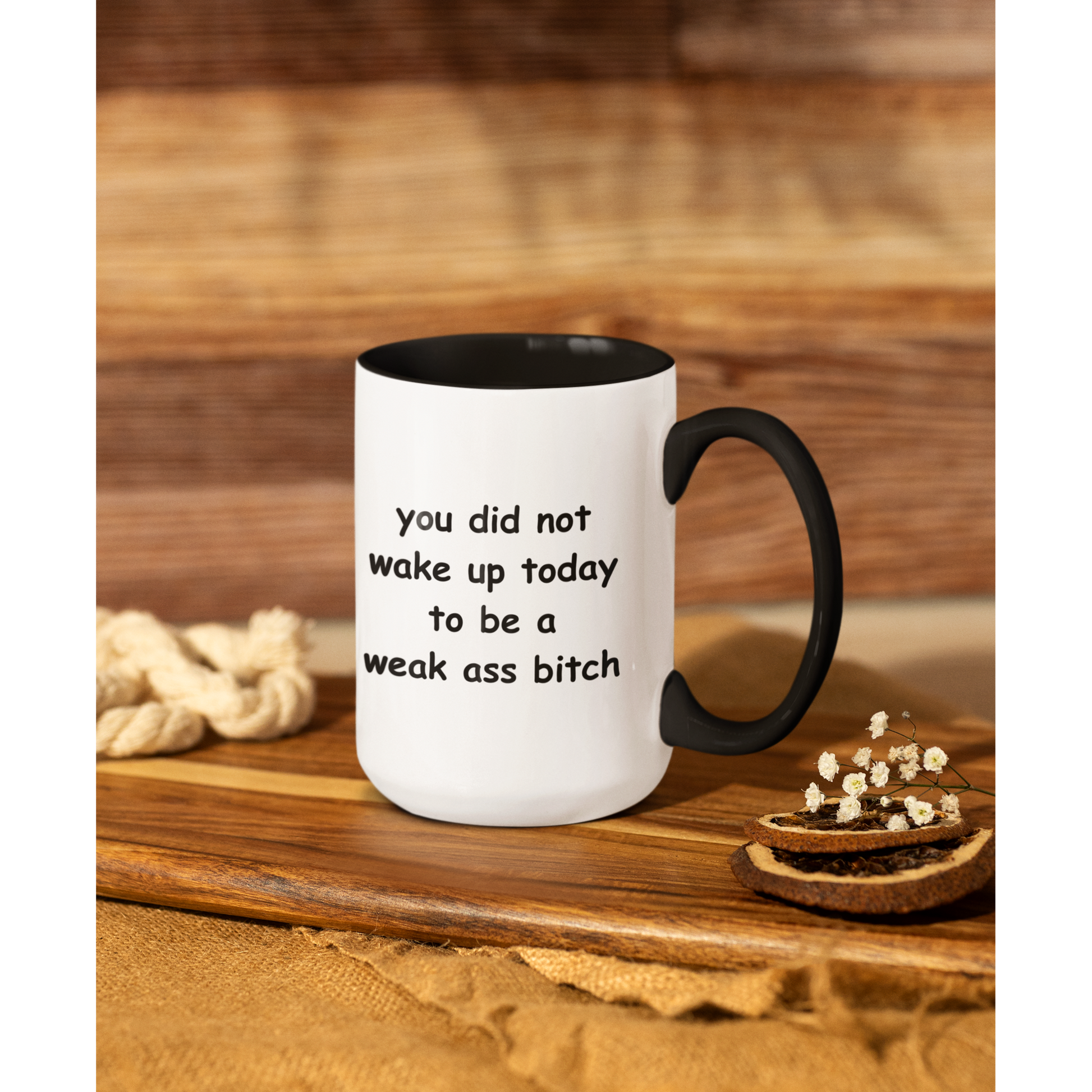 Stylish 15 oz two-tone ceramic coffee mug featuring a bold motivational message printed in playful black text. The phrase reads, “you did not wake up today to be a weak ass bitch,” inspiring confidence and a go-getter mindset with every sip. The mug has a sleek black handle and interior, contrasting sharply with the glossy white exterior for a modern look. Perfect for morning coffee, tea, or as a fun, empowering gift for friends who love a little sass with their caffeine fix.
