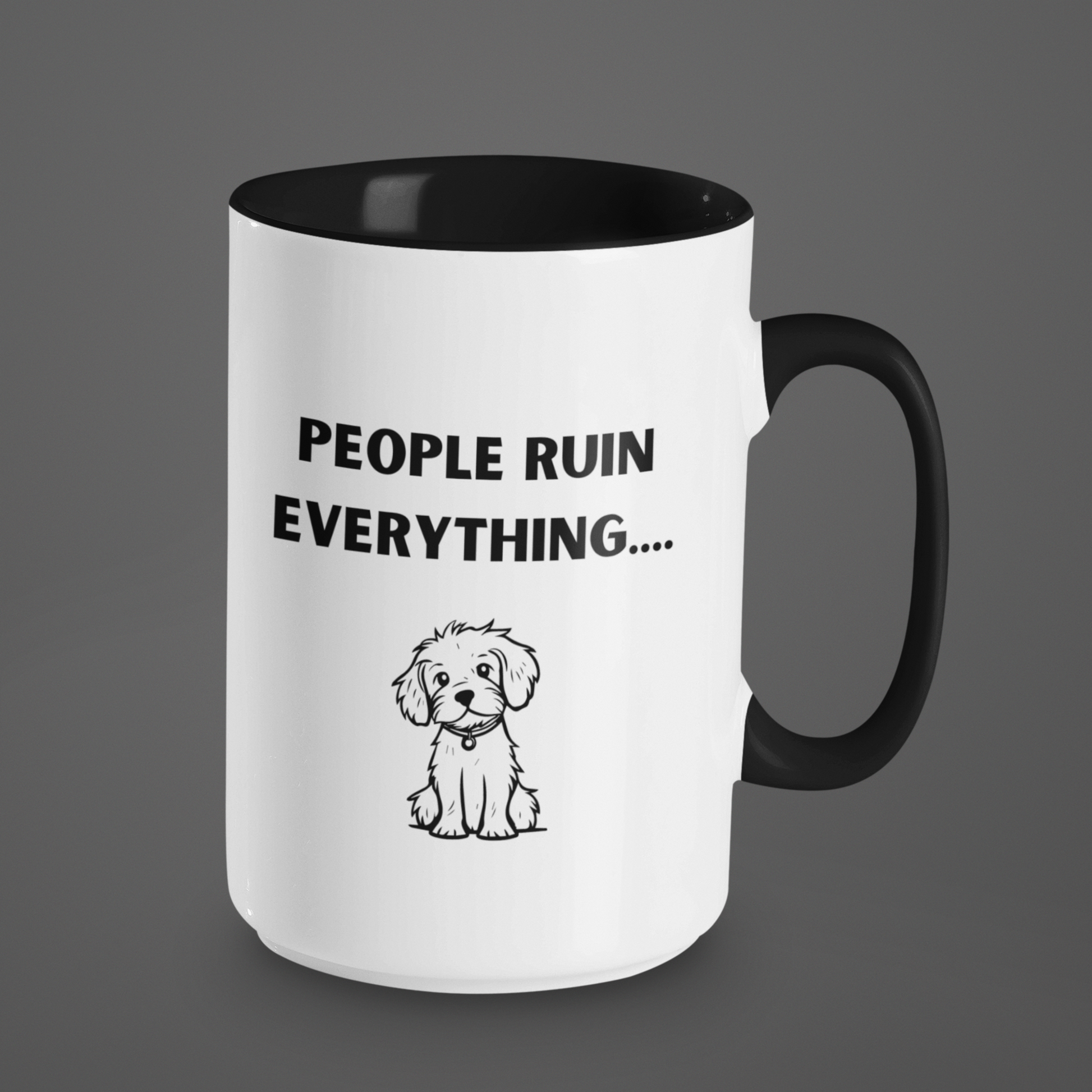 15 oz ceramic coffee mug featuring a humorous and relatable design. The exterior is glossy white with a black handle and black interior for a sleek, modern contrast. Printed on the front is the phrase "PEOPLE RUIN EVERYTHING...." in bold, playful black font. Below the text is an adorable illustration of a small, scruffy dog with a sweet, innocent expression, adding charm and humor to the message.