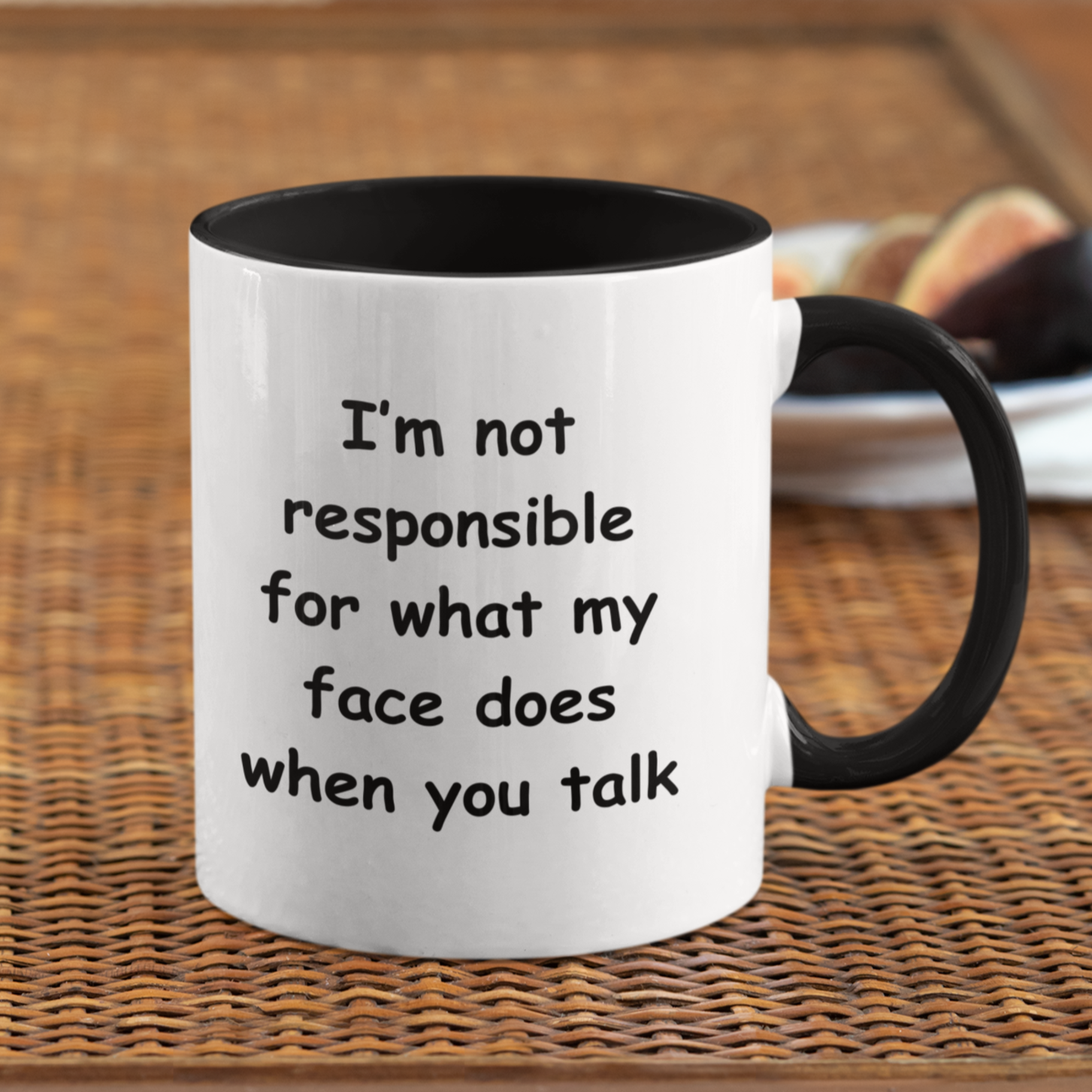 A white ceramic coffee mug with a black handle and black interior, designed for a modern and humorous touch. The mug features a bold, playful black font that reads: "I'm not responsible for what my face does when you talk." Perfect for those with a witty sense of humor, this 11oz mug makes a fun gift for coworkers, friends, or anyone who appreciates sarcasm. The high-quality print ensures the text remains sharp and vibrant, making it a standout addition to any kitchen or office space.
