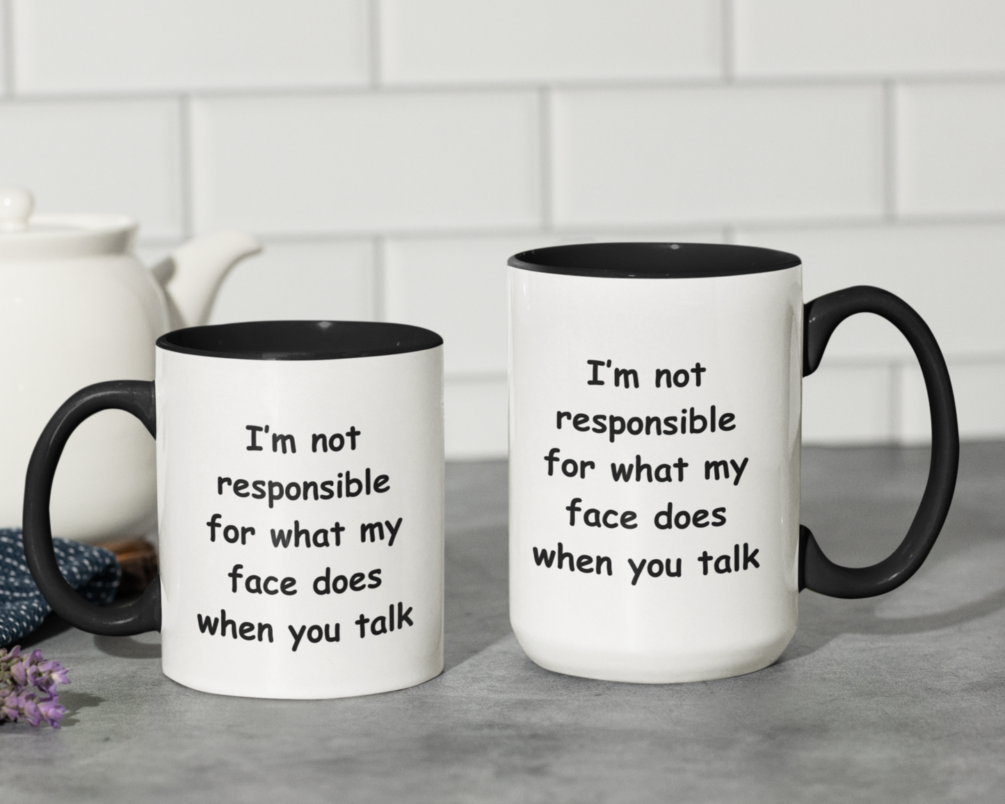 A white ceramic coffee mug with a black handle and black interior, designed for a modern and humorous touch. The mug features a bold, playful black font that reads: "I'm not responsible for what my face does when you talk." Perfect for those with a witty sense of humor, this  11 & 15oz mug makes a fun gift for coworkers, friends, or anyone who appreciates sarcasm. The high-quality print ensures the text remains sharp and vibrant, making it a standout addition to any kitchen or office space.