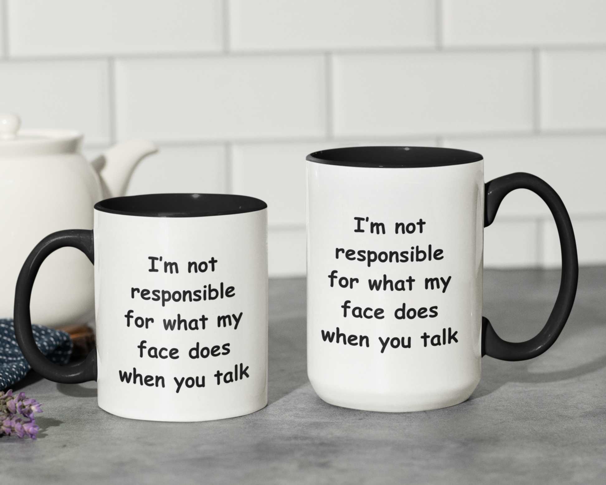 A white ceramic coffee mug with a black handle and black interior, designed for a modern and humorous touch. The mug features a bold, playful black font that reads: "I'm not responsible for what my face does when you talk." Perfect for those with a witty sense of humor, this  11 & 15oz mug makes a fun gift for coworkers, friends, or anyone who appreciates sarcasm. The high-quality print ensures the text remains sharp and vibrant, making it a standout addition to any kitchen or office space.